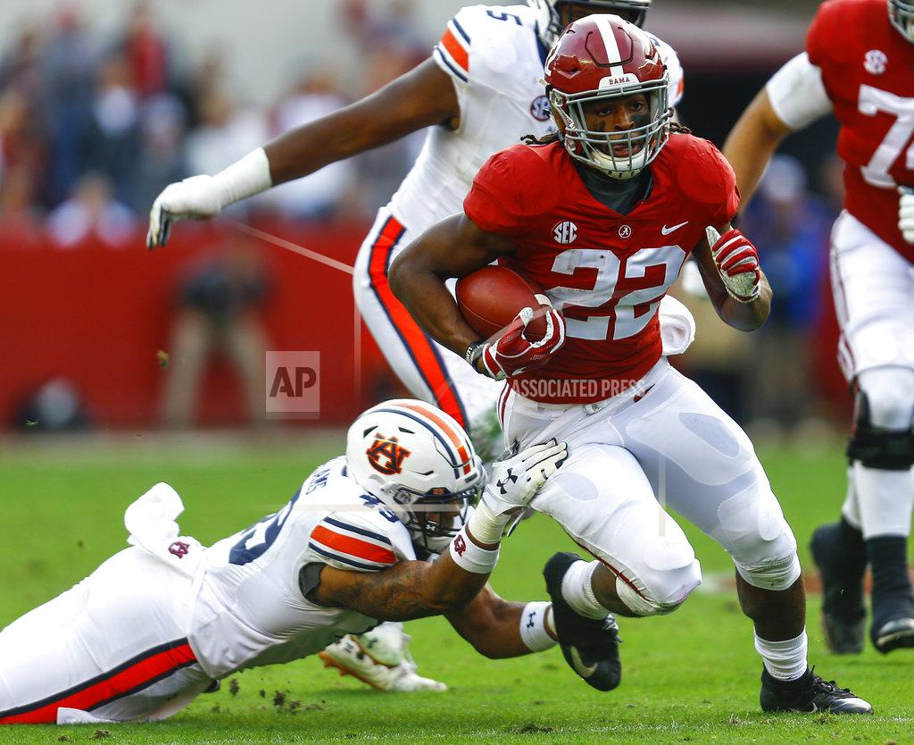 Butch Dill Alabama running back Najee Harris (22) carries the ball as Auburn linebacker Darrell Williams (49) tries to tackle him during the first half of an NCAA college football game, Saturday, Nov. 24, 2018, in Tuscaloosa, Ala. (AP Photo/Butch Dill)