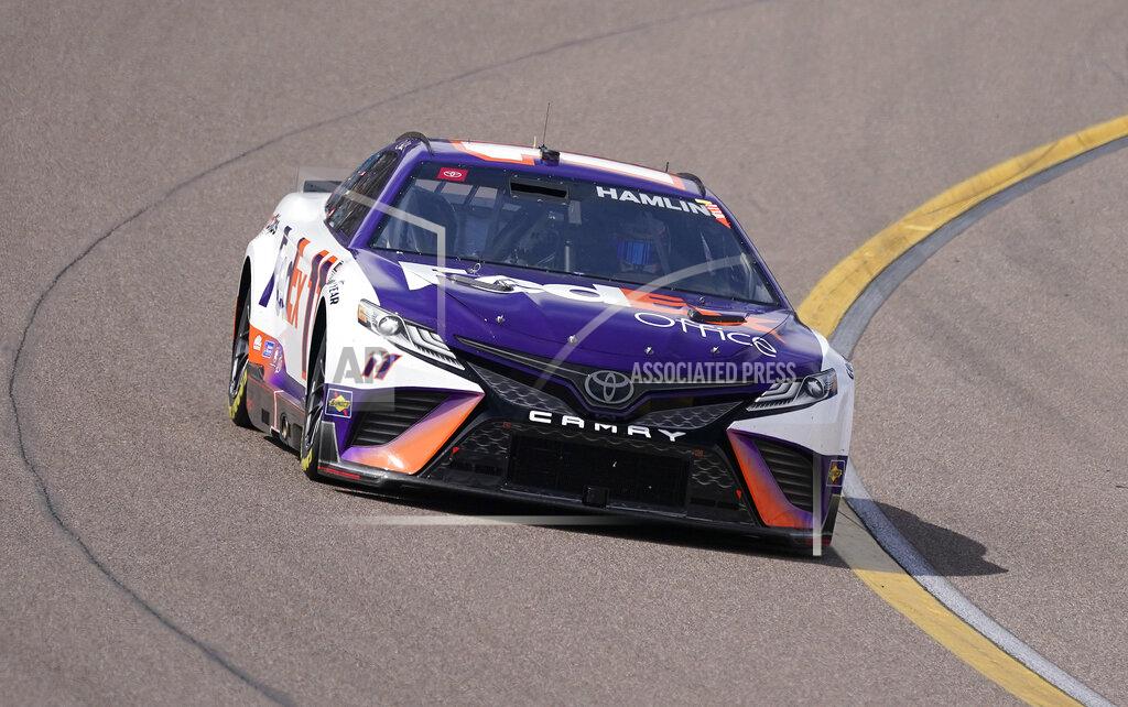 Darryl Webb Denny Hamlin (11) runs second early in a NASCAR Cup Series auto race at Phoenix Raceway, Sunday, March 13, 2022, in Avondale, Ariz. (AP Photo/Darryl Webb)