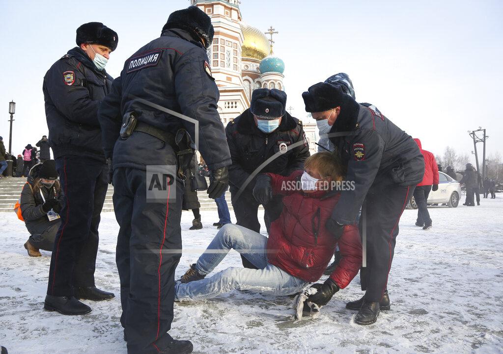 Uncredited Police detain a man during a protest against the jailing of opposition leader Alexei Navalny in Siberian city of Omsk, Russia, Saturday, Jan. 23, 2021. Russian police on Saturday arrested hundreds of protesters who took to the streets in temperatures as low as minus-50 C (minus-58 F) to demand the release of Alexei Navalny, the country's top opposition figure. Navalny, President Vladimir Putin's most prominent foe, was arrested on Jan. 17 when he returned to Moscow from Germany, where he had spent five months recovering from a severe nerve-agent poisoning that he blames on the Kremlin (AP Photo)