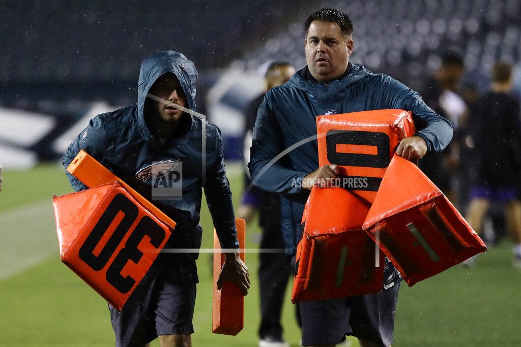 Michael Perez Workers remove sideline markers after a storm ended a preseason NFL football game between the Philadelphia Eagles and the Baltimore Ravens, Thursday, Aug. 22, 2019, in Philadelphia. (AP Photo/Michael Perez)
