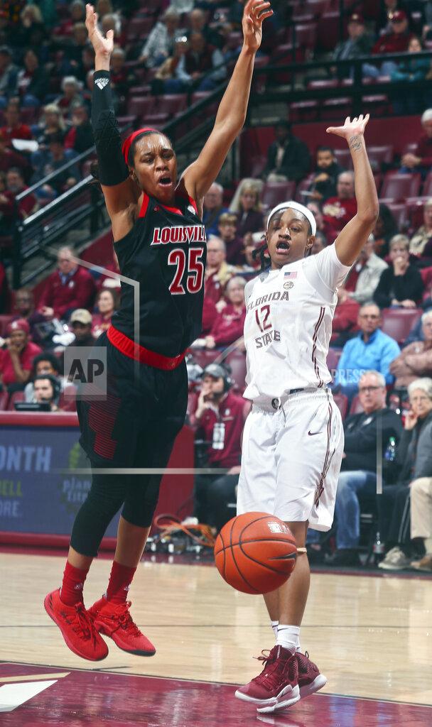Phil Sears Louisville guard Asia Durr (25) is fouled by Florida State guard Nicole Ekhomu (12) as she goes for a layup during the second half of an NCAA college basketball game in Tallahassee, Fla., Thursday, Jan. 24, 2019. (AP Photo/Phil Sears)