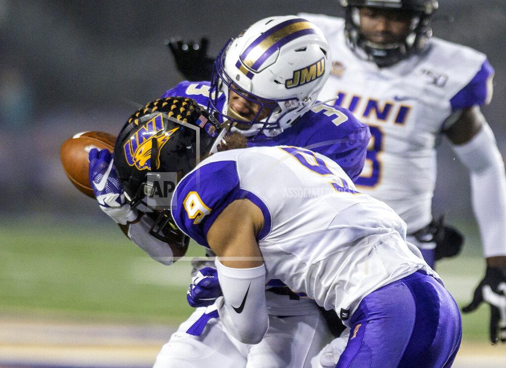 Daniel Lin James Madison wide receiver Brandon Polk (3) drops a pass as he is tackled by Northern Iowa defensive back Xavior Williams (9) during the first half of a quarterfinal game in the NCAA college Football Championship Subdivision playoffs in Harrisonburg, Va., Friday, Dec. 13, 2019. (Daniel Lin/Daily News-Record via AP)