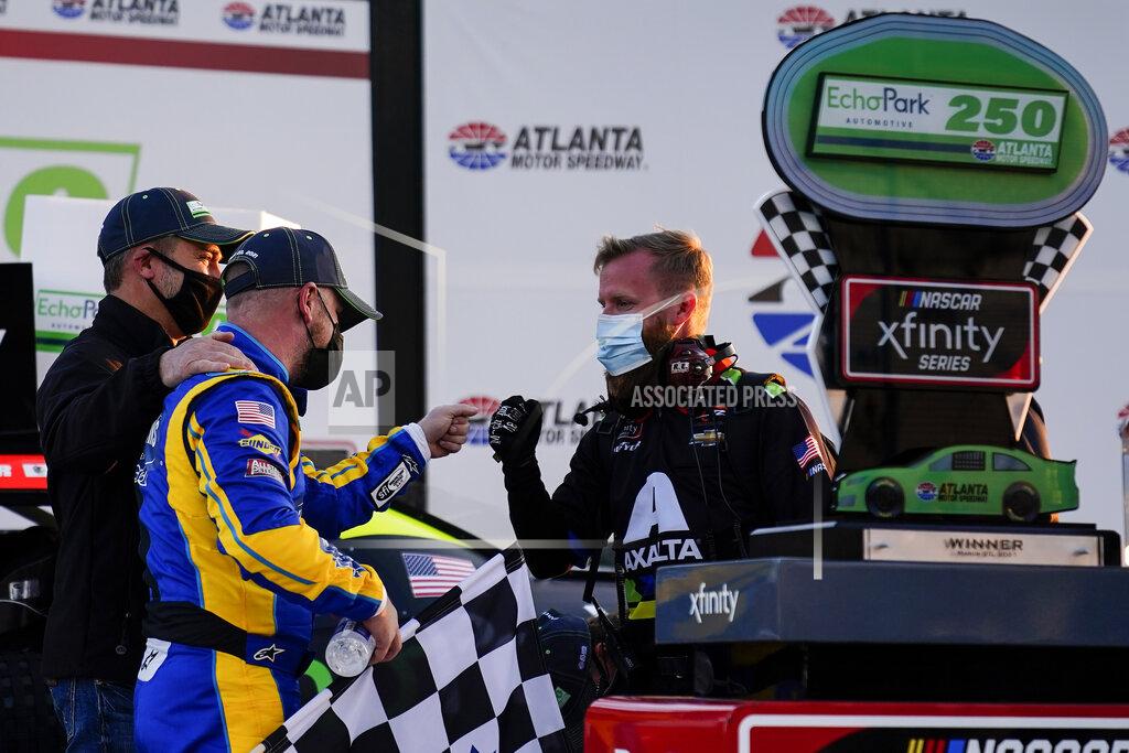 Brynn Anderson NASCAR driver Justin Allgaier, left, celebrates with his team after a win after a NASCAR Xfinity Series at Atlanta Motor Speedway on Saturday, March 20, 2021, in Hampton, Ga. (AP Photo/Brynn Anderson)