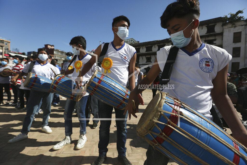 Niranjan Shrestha Devotees play traditional drums during the annual Indra Jatra festival in Kathmandu, Nepal, Sunday, Sept. 19, 2021. The feast of Indra Jatra marks the return of the festival season in the Himalayan nation two years after it was scaled down because the pandemic. (AP Photo/Niranjan Shrestha)