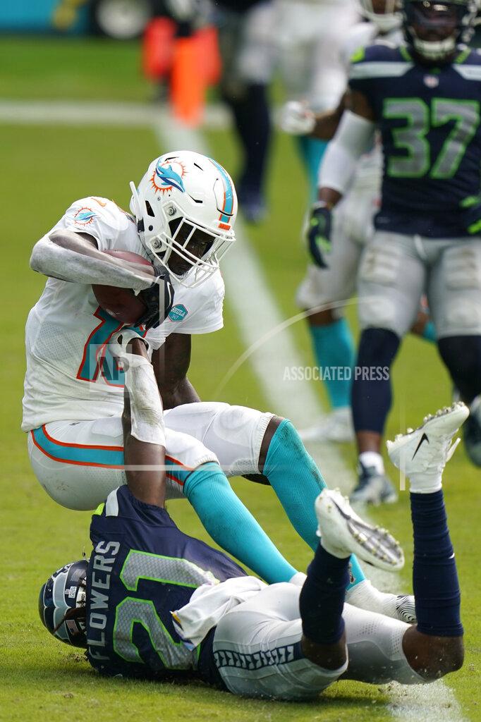 Wilfredo Lee Miami Dolphins wide receiver Preston Williams (18) catches a pass in the enzone for a two point conversion as Seattle Seahawks cornerback Tre Flowers (21) defends, during the second half of an NFL football game, Sunday, Oct. 4, 2020 in Miami Gardens, Fla. (AP Photo/Wilfredo Lee)