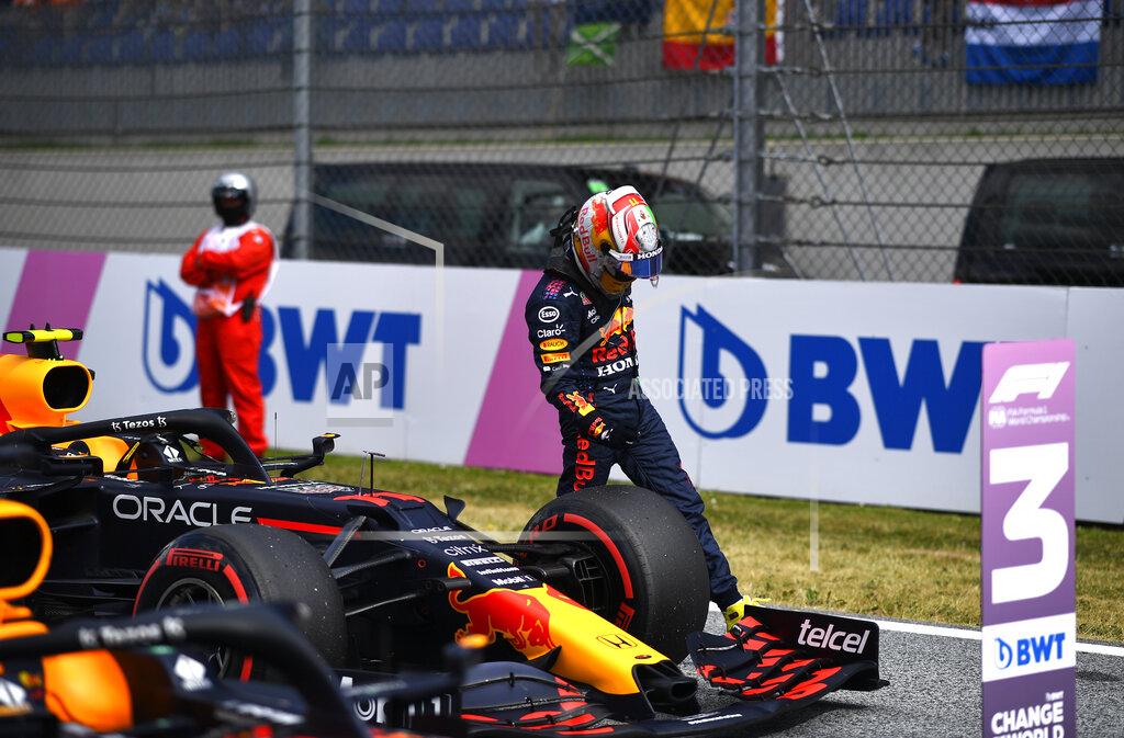 Christian Bruna Red Bull driver Sergio Perez of Mexico gets out of his car after placing third during the qualifying session ahead of the Austrian Formula One Grand Prix at the Red Bull Ring racetrack in Spielberg, Austria, Saturday, July 3, 2021. The Austrian Grand Prix will be held on Sunday. (Christian Bruna/Pool Photo via AP)