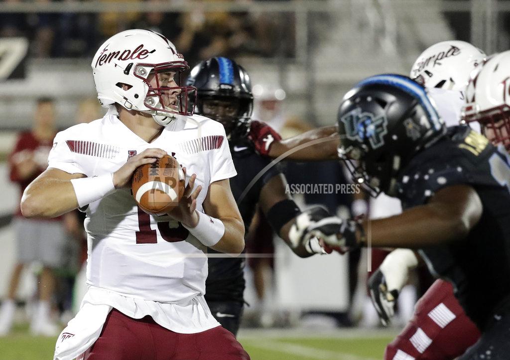 John Raoux Temple quarterback Anthony Russo looks for a receiver as he is pressured by the Central Florida defense during the first half of an NCAA college football game Thursday, Nov. 1, 2018, in Orlando, Fla. (AP Photo/John Raoux)