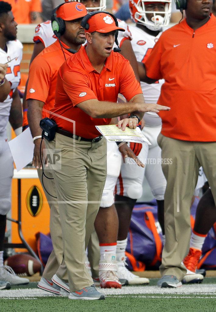 Chuck Burton Clemson head coach Dabo Swinney signals is team during the first half of an NCAA college football game against Wake Forest in Charlotte, N.C., Saturday, Oct. 6, 2018. (AP Photo/Chuck Burton)
