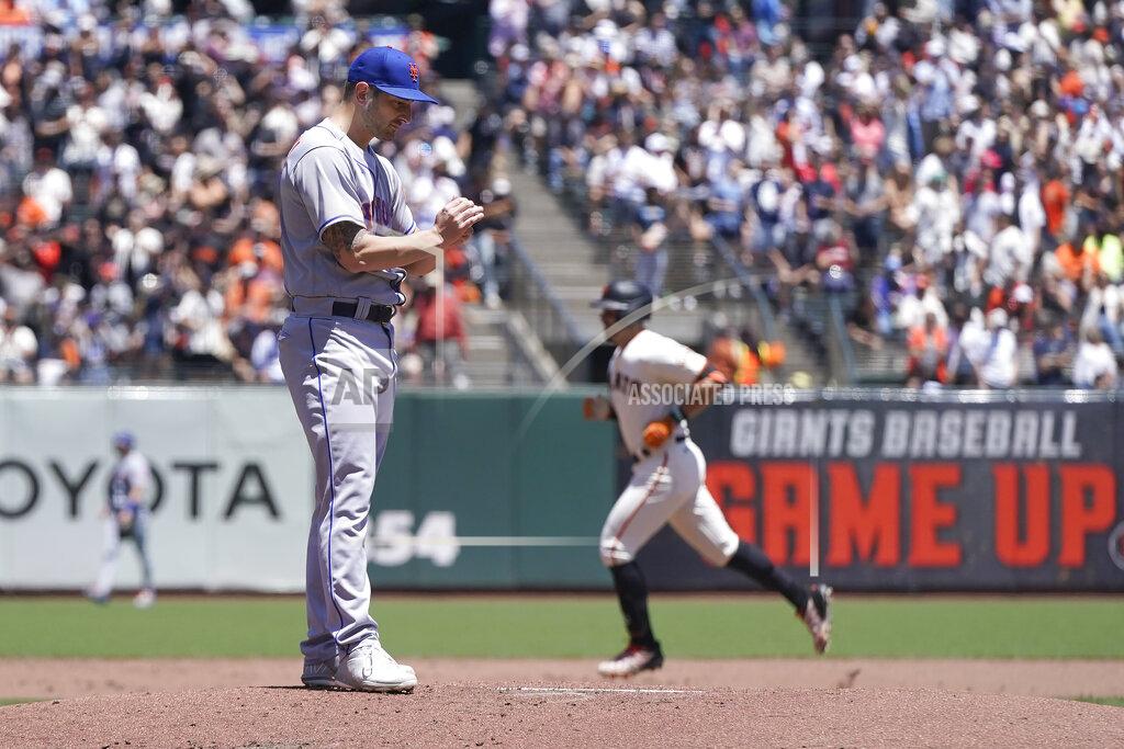 Jeff Chiu San Francisco Giants' Evan Longoria, right, rounds the bases after hitting a home run off of New York Mets pitcher Thomas Szapucki, foreground, during the second inning of a baseball game in San Francisco, Wednesday, May 25, 2022. (AP Photo/Jeff Chiu)