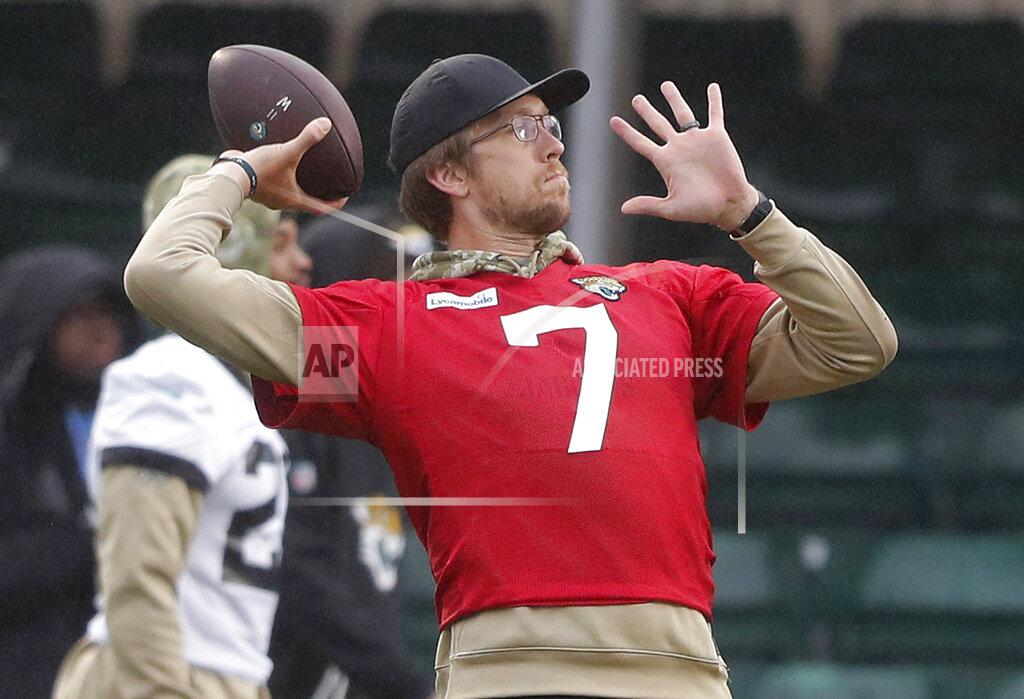 Jaguars QB Nick Foles throws during a NFL training session of the Jacksonville Jaguars at the at Allianz Park in London, Friday, Nov. 1, 2019.The Jacksonville Jaguars are preparing for an NFL regular season game against the Houston Texans in London on Sunday. (AP Photo/Frank Augstein)