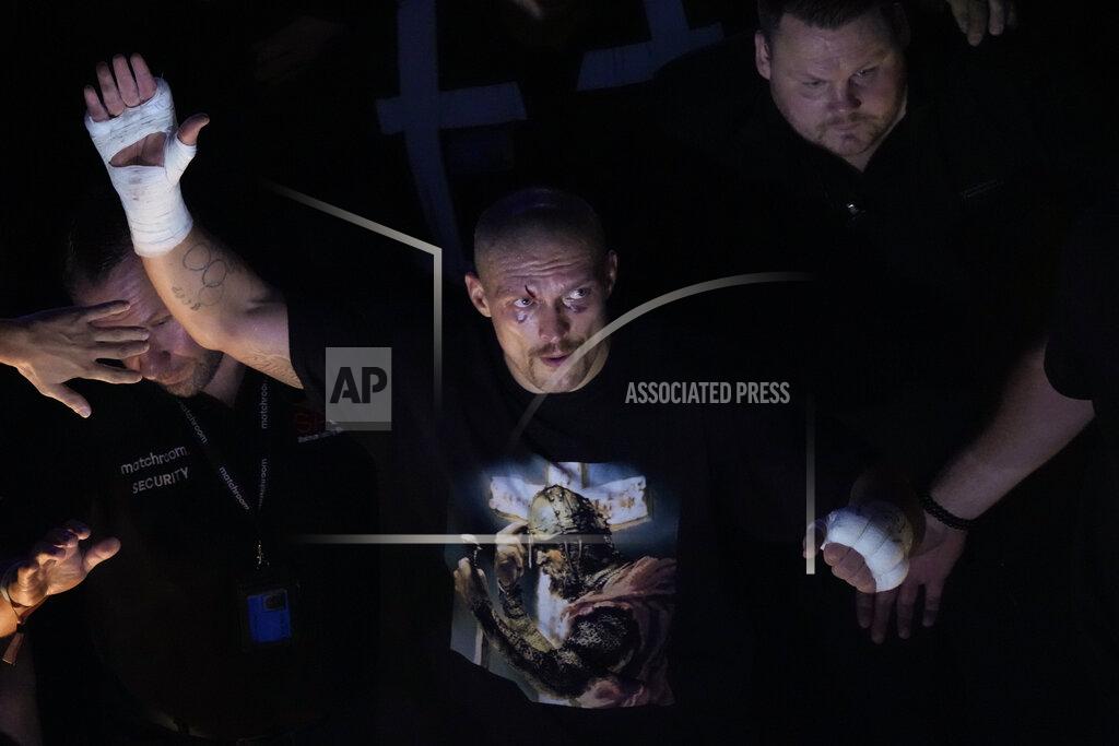 Frank Augstein Oleksandr Usyk of Ukraine waves to spectators after his unanimous decision victory over Anthony Joshua of Britain in their WBA (Super), WBO and IBF boxing title bout at the Tottenham Hotspur Stadium in London, Saturday, Sept. 25, 2021. (AP Photo/Frank Augstein)