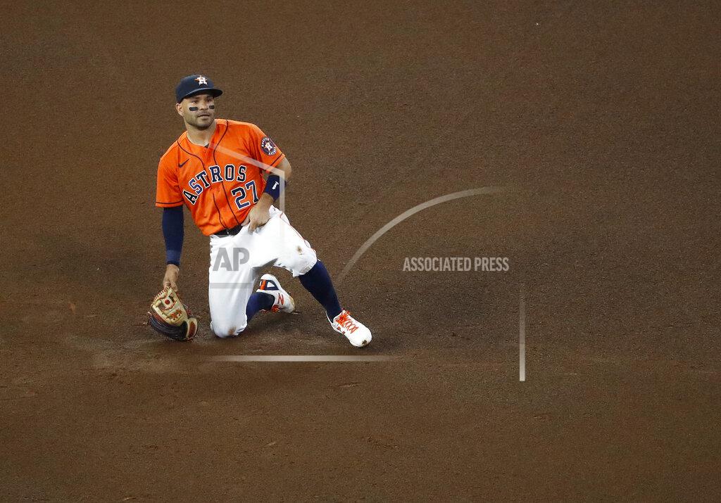 Kevin M. Cox Houston Astros second baseman Jose Altuve reacts after a throwing error by shortstop Carlos Correa allowed Oakland Athletics' Stephen Piscotty to reach second base in the top of the fourth inning of a baseball game Friday, April 9, 2021, in Houston. (Kevin M. Cox/The Galveston County Daily News via AP)