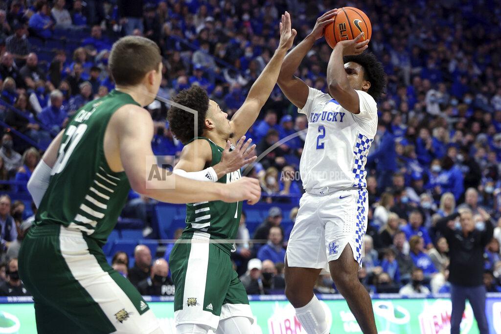 James Crisp Kentucky's Sahvir Wheeler (2) shoots while defended by Jason Carter, left, and Mark Sears (1) during the first half of an NCAA college basketball game in Lexington, Ky., Friday, Nov. 19, 2021. (AP Photo/James Crisp)