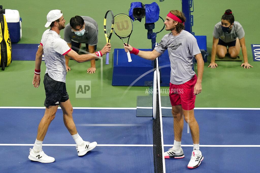 Frank Franklin Ii Stefanos Tsitsipas, of Greece, right, taps rackets with Maxime Cressy, of the United States, after their second round of the U.S. Open tennis championships, Wednesday, Sept. 2, 2020, in New York. Tsitsipas won the match. (AP Photo/Frank Franklin II)