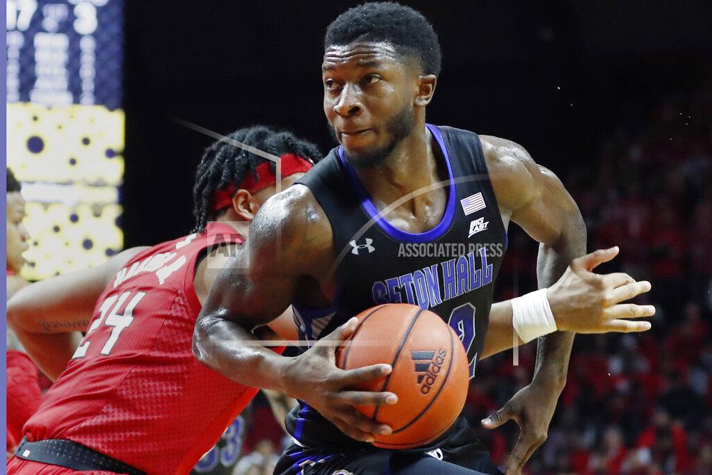 Kathy Willens Rutgers guard Ron Harper Jr. (24) gets tangled up with Seton Hall guard Myles Cale (22) during the first half of an NCAA college basketball game, Saturday, Dec. 14, 2019, in Piscataway, N.J. (AP Photo/Kathy Willens)