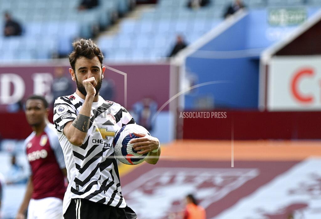 Shaun Botterill Manchester United's Bruno Fernandes celebrates after scoring his side's opening goal from penalty during the English Premier League soccer match between Aston Villa and Manchester United at Villa Park in Birmingham, England, Sunday, May 9, 2021. (Shaun Botterill/Pool via AP)