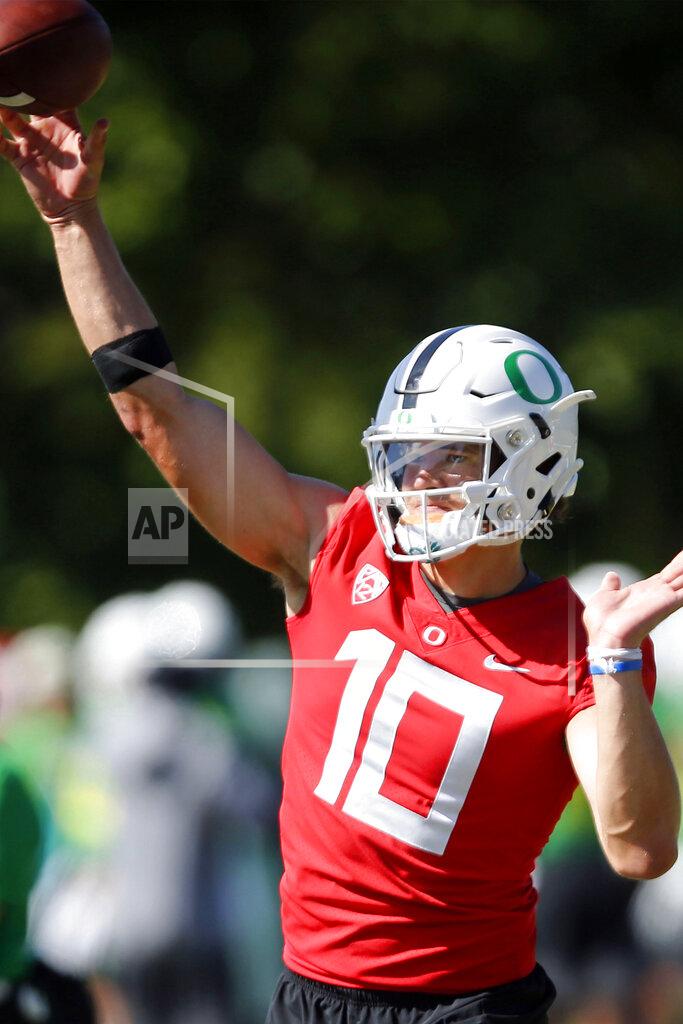 Andy Nelson FILE - In this Aug. 2, 2019, file photo, Oregon quarterback Justin Herbert throws during a drill at NCAA college football practice in Eugene, Ore. No. 16 Auburn freshman quarterback Bo Nix makes his college debut by matching up against No. 11 Oregon quarterback and potential first-round draft pick Justin Herbert in Arlington, Texas on Saturday, Aug. 31. (Andy Nelson/The Register-Guard via AP, File)