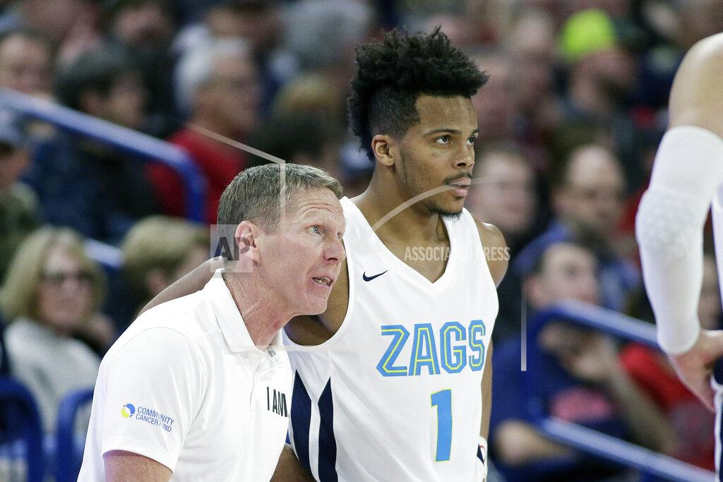 Young Kwak Gonzaga head coach Mark Few, left, speaks with guard Admon Gilder (1) during the second half of an NCAA college basketball game against Eastern Washington in Spokane, Wash., Saturday, Dec. 21, 2019. Gonzaga won 112-77. (AP Photo/Young Kwak)