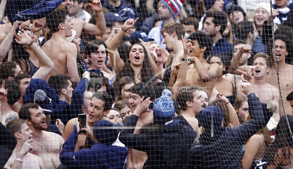 Charles Krupa With temperatures in the 40's, the Yale students cheer with their shirts off during the second half of an NCAA college football game against Harvard at Fenway Park in Boston, Saturday, Nov. 17, 2018. (AP Photo/Charles Krupa)