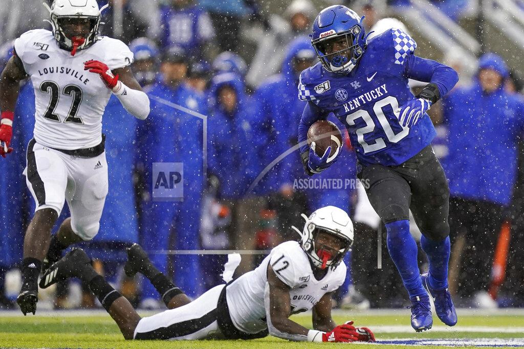 Bryan Woolston Kentucky running back Kavosiey Smoke (20) runs the ball during the first half of the NCAA college football game against Louisville, Saturday, Nov. 30, 2019, in Lexington, Ky. (AP Photo/Bryan Woolston)