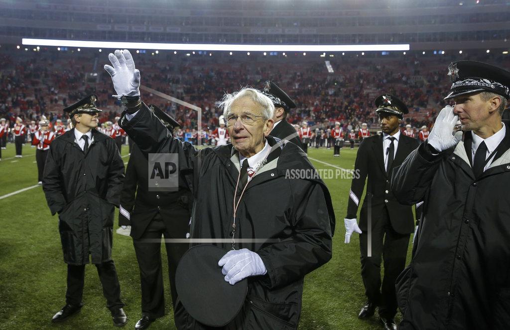 Andy Manis University of Wisconsin-Madison Marching Band Director Mike Leckrone waves to the fans in the stadium after an NCAA college football game Saturday, Nov. 24, 2018, in Madison, Wis. Leckrone is retiring after 50 years of directing the UW band. Minnesota beat Wisconsin 37-15. (AP Photo/Andy Manis)