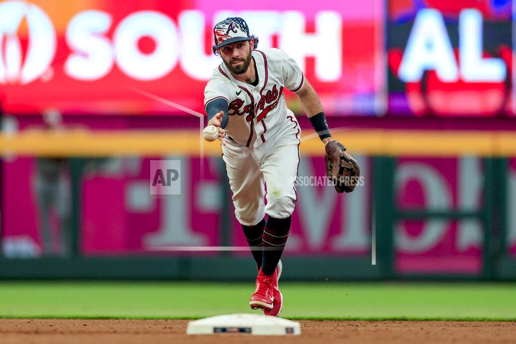 Butch Dill Atlanta Braves shortstop Dansby Swanson tosses the ball towards second base during the third inning of a baseball game against the St. Louis Cardinals Monday, July 4, 2022, in Atlanta. St. Louis Cardinals' Juan Yepez was ruled safe as Atlanta Braves second baseman Phil Gosselin missed the tag. (AP Photo/Butch Dill)