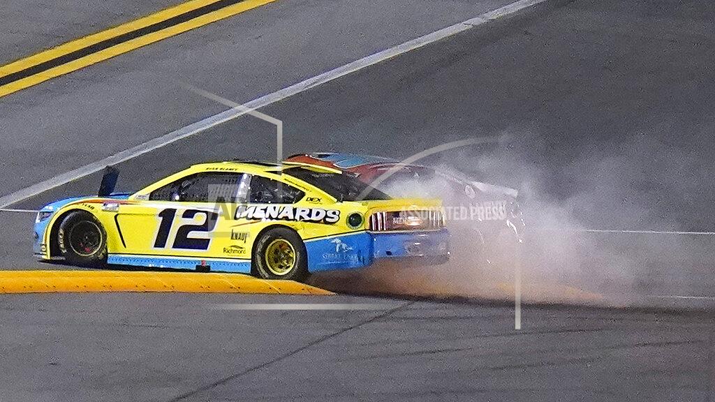 Chris O'meara Drivers Ryan Blaney (12) and Chase Elliott (9) crash during the final lap of the NASCAR Daytona Clash auto race Tuesday, Feb. 9, 2021, at Daytona International Speedway in Daytona Beach, Fla. (AP Photo/Chris O'Meara)