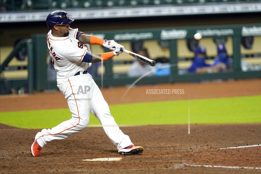 David J. Phillip Houston Astros' Martin Maldonado hits a home run against the Texas Rangers during the eighth inning of a baseball game Tuesday, Sept. 15, 2020, in Houston. (AP Photo/David J. Phillip)