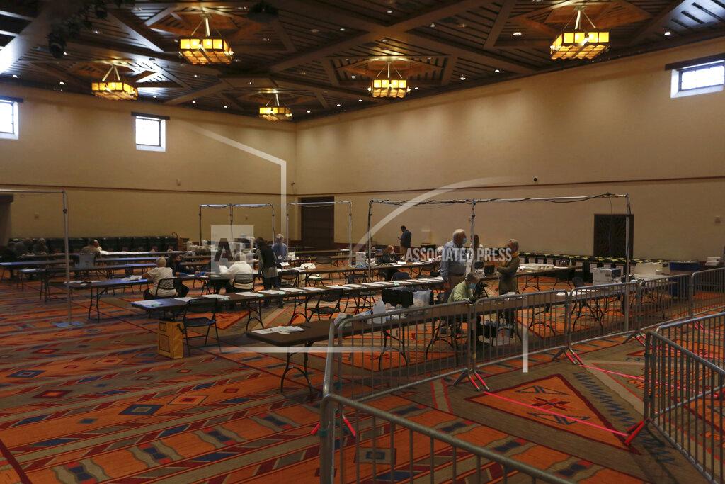 Cedar Attanasio Election workers sort ballots at the Santa Fe Convention Center on Election Day, Tuesday, Nov. 3, 2020, in Santa Fe, N.M. (AP Photo/Cedar Attanasio)