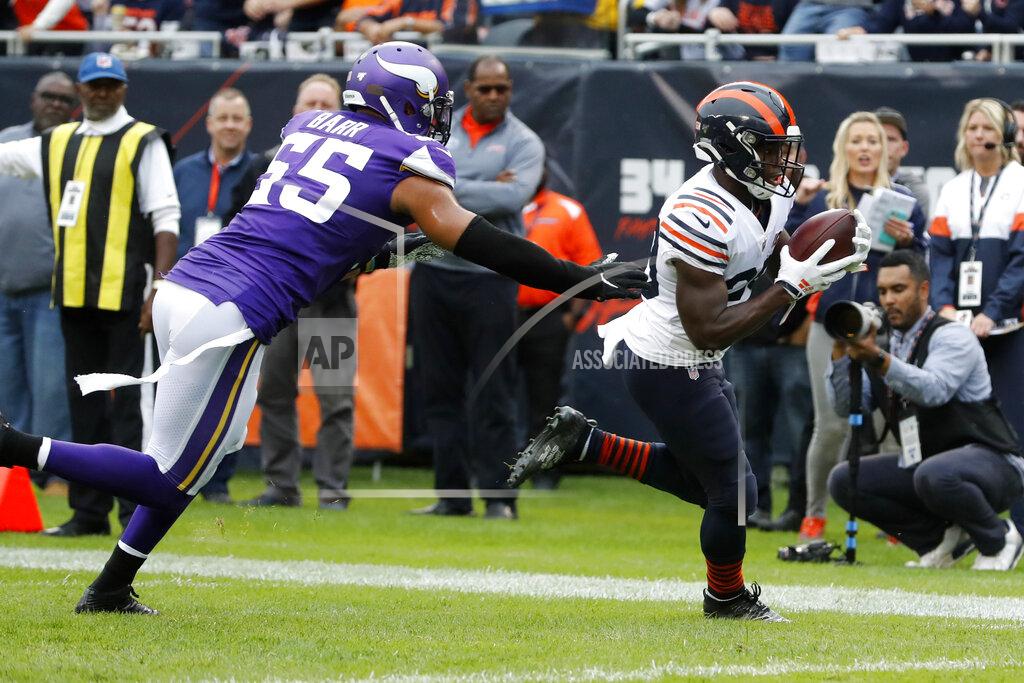 Charles Rex Arbogast Chicago Bears running back Tarik Cohen, right, catches a 10-yard pass for a touchdown as Minnesota Vikings outside linebacker Anthony Barr (55) defends during the half of an NFL football game Sunday, Sept. 29, 2019, in Chicago. (AP Photo/Charles Rex Arbogast)