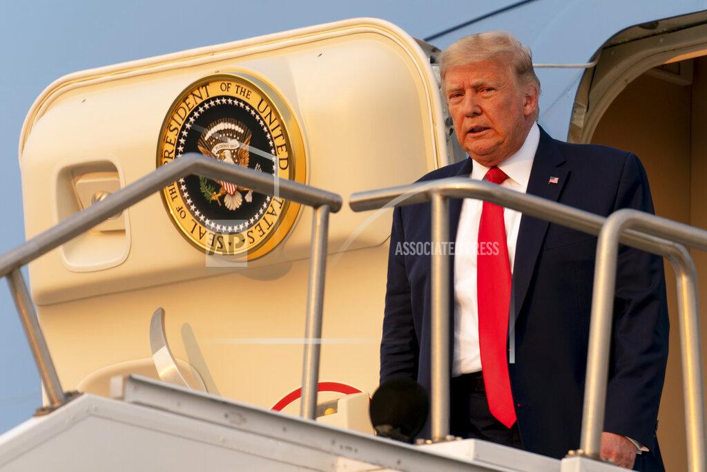 Andrew Harnik President Donald Trump arrives at Reno-Tahoe International Airport in Reno, Nev., Saturday, Sept. 12, 2020, to travel to a rally in Minden, Nev. (AP Photo/Andrew Harnik)