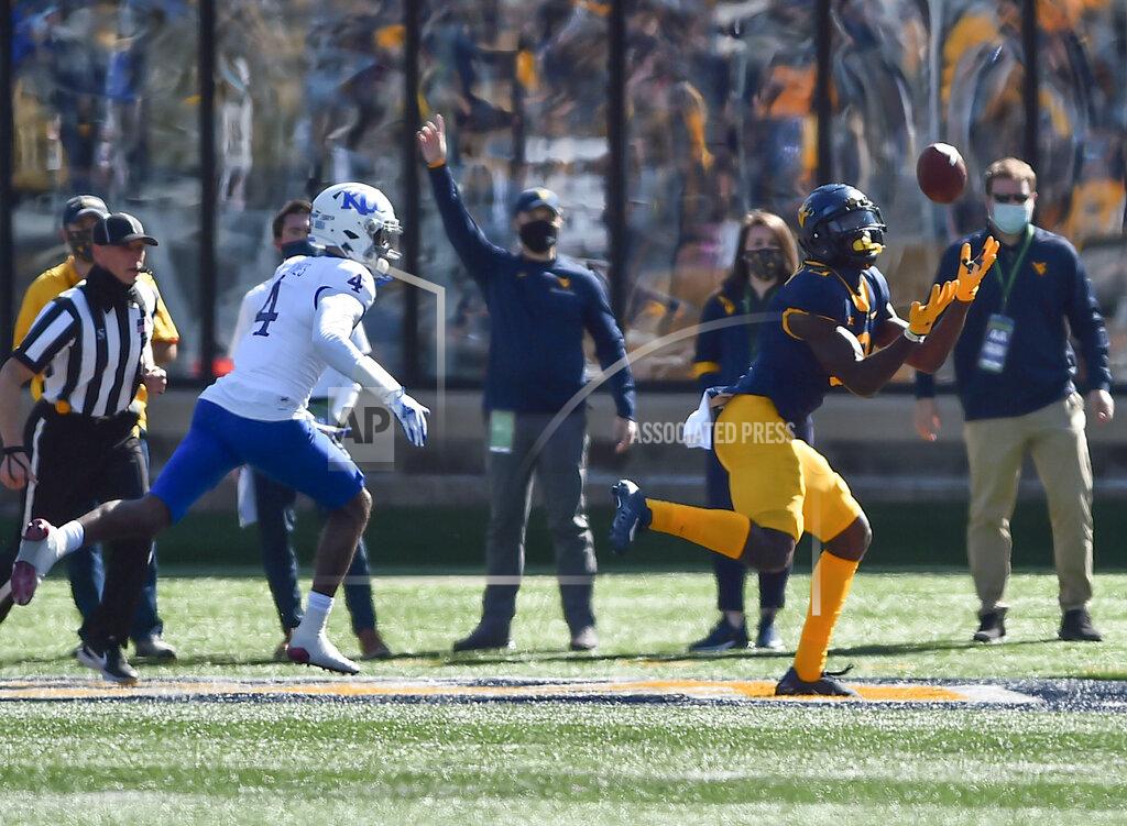 William Wotring West Virginia wide receiver Bryce Ford-Wheaton (0) makes a catch for a touchdown against Kansas
during an NCAA college football game, Saturday, Oct. 17, 2020, in Morgantown, W.Va. (William Wotring/The Dominion-Post via AP)