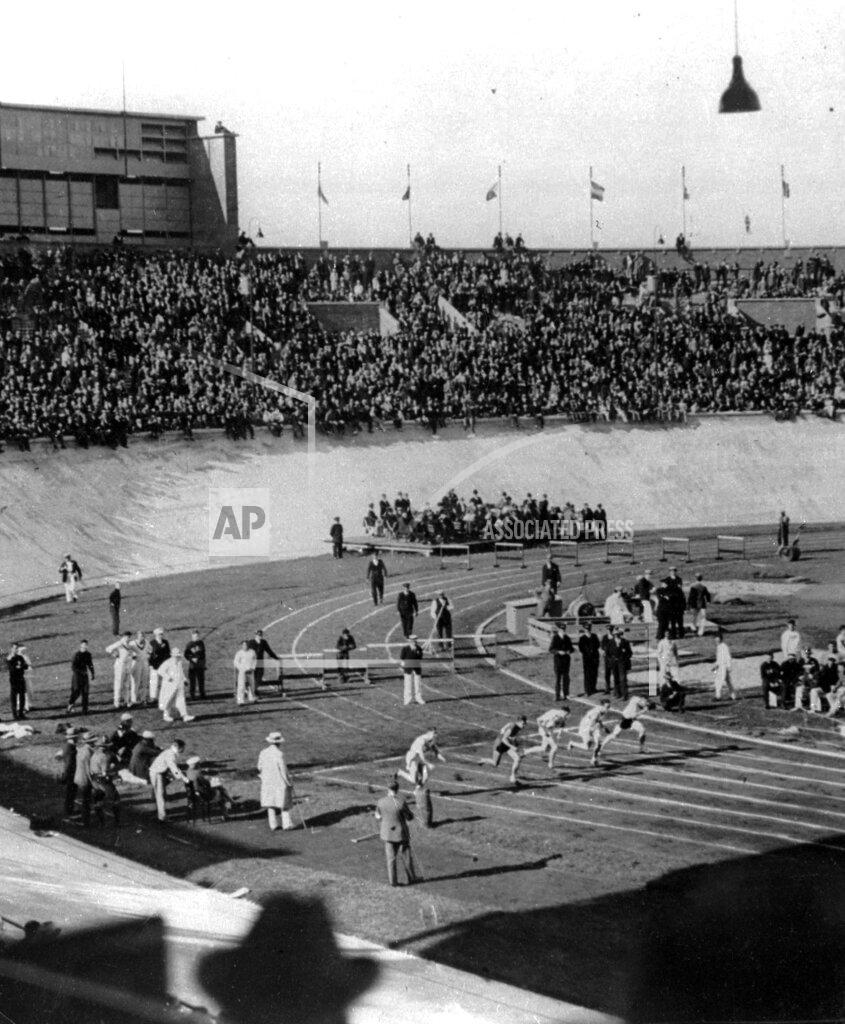 Uncredited FILE - In this March 1928, file photo, the world's greatest sprinters are off from their marks at the start of one of the heats in the 100-meter race at the Opening of the Olympic games in Amsterdam, The Netherlands. Percy Williams, an unknown schoolboy from Canada, captured the finals. (AP Photo/File)