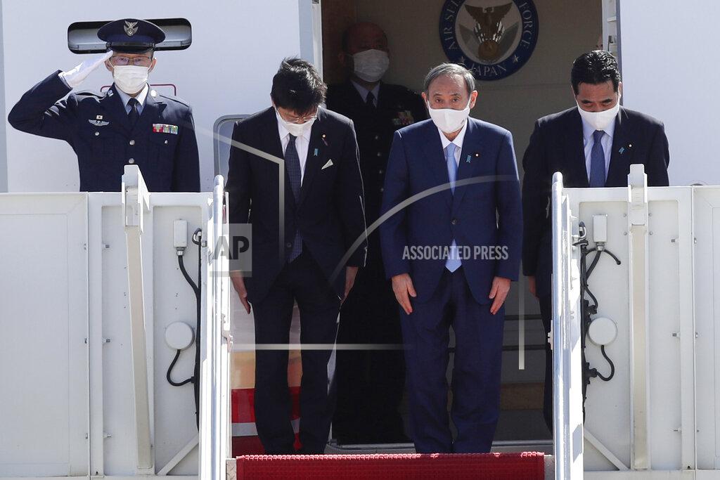 Luis M. Alvarez Japanese Prime Minister Yoshihide Suga boards his plane to depart at Andrews Air Force Base, Md., Saturday, April 17, 2021, after his visit to Washington. (AP Photo/Luis M. Alvarez)