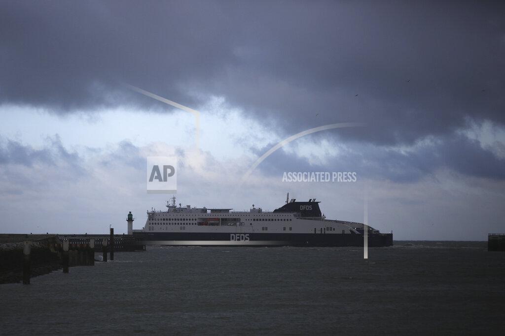 Rafael Yaghobzadeh A ferry bound for Britain leaves the port of Calais, northern France, Thursday, Nov. 25, 2021 in . Children and pregnant women were among at least 27 migrants who died when their small boat sank in an attempted crossing of the English Channel, a French government official said Thursday. French Interior Minister Gerald Darmanin also announced the arrest of a fifth suspected smuggler thought to have been involved in what was the deadliest migration tragedy to date on the dangerous sea lane. (AP Photo/Rafael Yaghobzadeh)