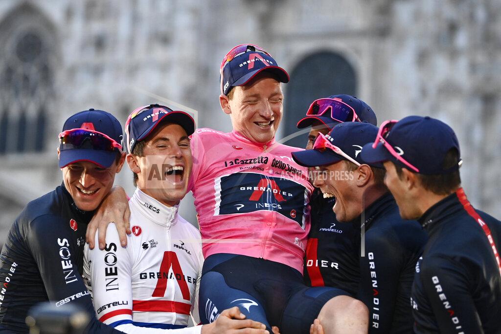 Marco Alpozzi Britain’s Tao Geoghegan Hart celebrates with teammates after winning the Giro d'Italia cycling race, in Milan, Italy, Sunday, Oct. 25, 2020. In one of the most exciting final stages of a Grand Tour, British rider Tao Geoghegan Hart won the Giro d’Italia on Sunday, edging out Australian Jai Hindley by just 39 seconds. (Marco Alpozzi/LaPresse via AP)