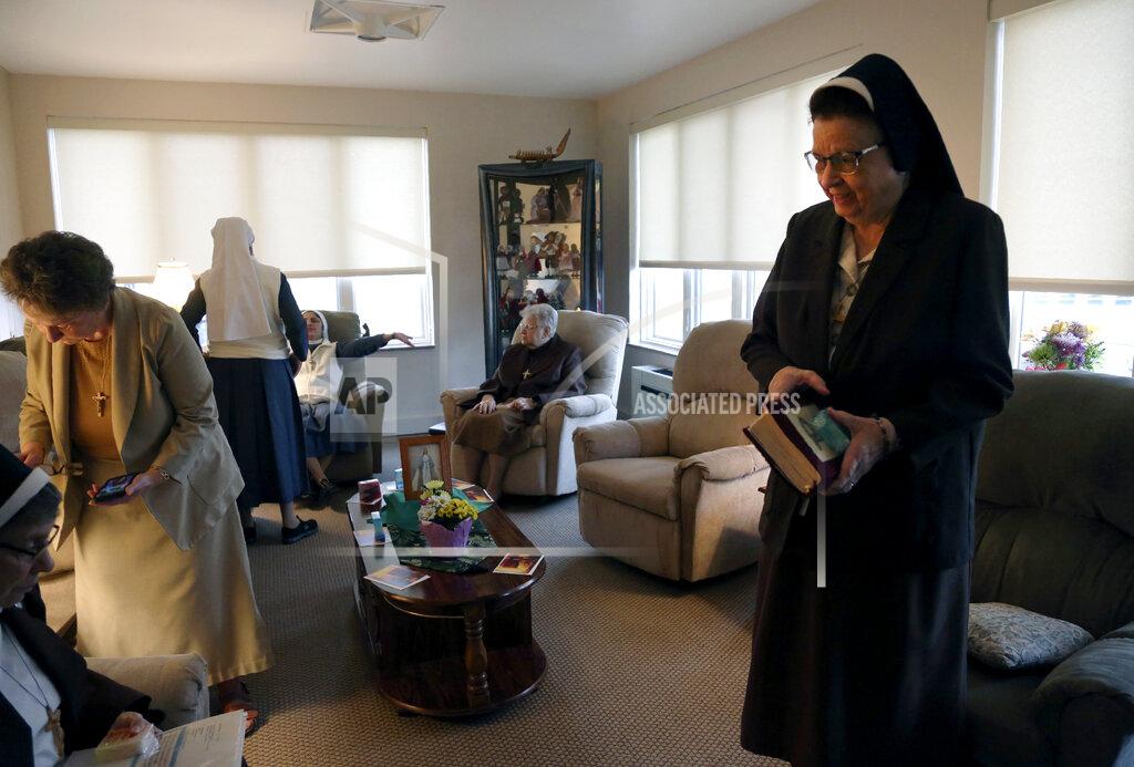 Jessie Wardarski Nuns of the Felician Sisters of North America conclude morning prayers at St. Anne Home in Greensburg, Pa., on Thursday, March 25, 2021. Last October the nuns lost one of their own, Sister Mary Evelyn Labik, to the coronavirus. (AP Photo/Jessie Wardarski)