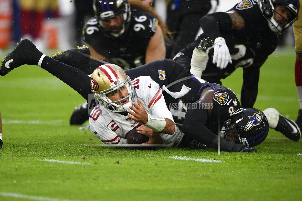 Nick Wass San Francisco 49ers quarterback Jimmy Garoppolo (10) looks up after being tackled by Baltimore Ravens inside linebacker Patrick Onwuasor (48) in the first half of an NFL football game, Sunday, Dec. 1, 2019, in Baltimore, Md. (AP Photo/Nick Wass)