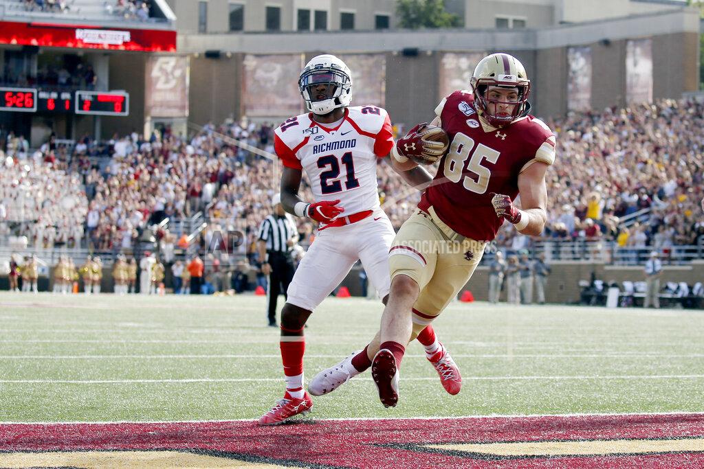 Mary Schwalm Boston College tight end Korab Idrizi (85) rushes for a touchdown ahead of Richmond defensive back Trent Williams (21) during the first half of an NCAA college football game, Saturday, Sept. 7, 2019, in Boston. (AP Photo/Mary Schwalm)
