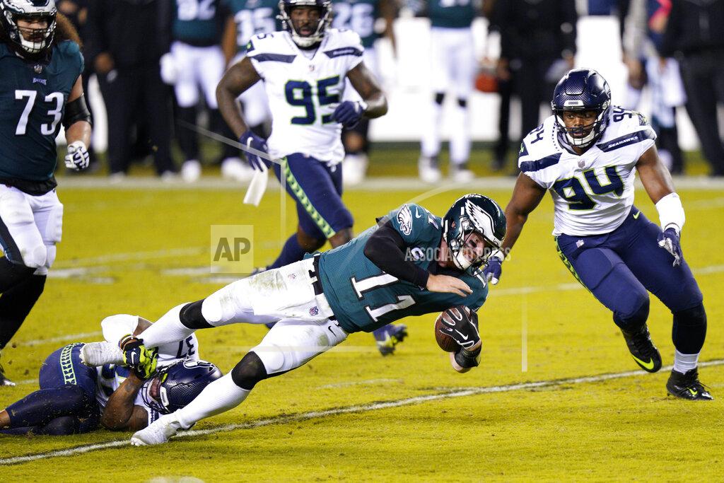 Chris Szagola Philadelphia Eagles' Carson Wentz (11) is tackled by Seattle Seahawks' Quandre Diggs (37) during the first half of an NFL football game, Monday, Nov. 30, 2020, in Philadelphia. (AP Photo/Chris Szagola)