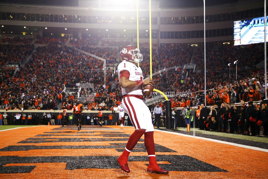 Ian Maule Oklahoma quarterback Jalen Hurts (1) catches a touchdown pass during an NCAA college football game against Oklahoma State, Saturday, Nov. 30, 2019, in Stillwater, Okla. (Ian Maule/Tulsa World via AP)