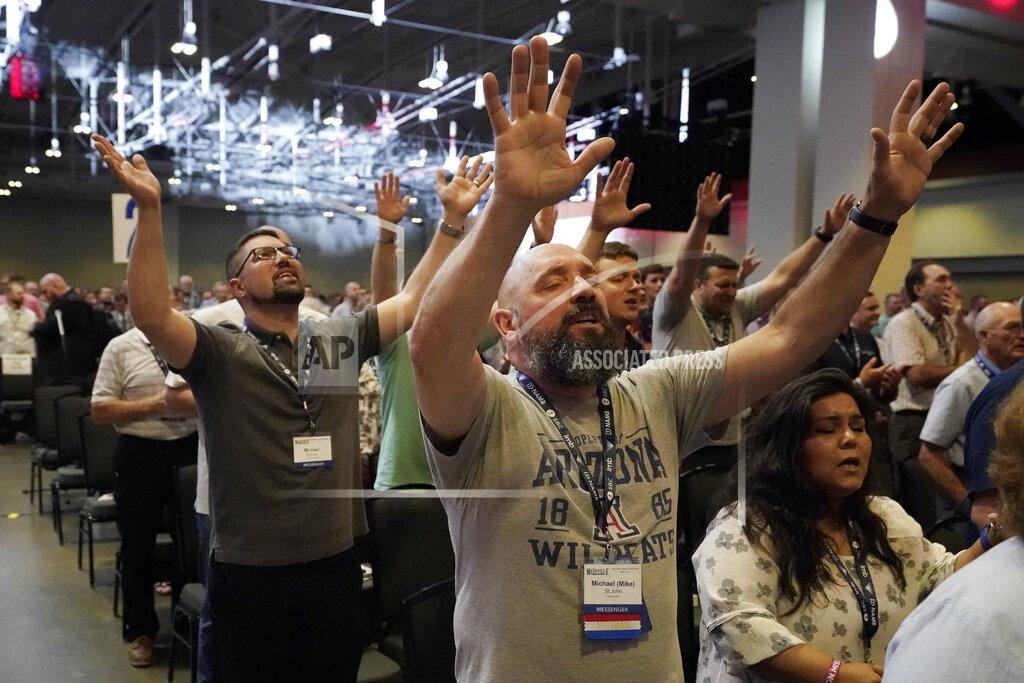 Mark Humphrey People take part in a worship service during the annual Southern Baptist Convention meeting Tuesday, June 15, 2021, in Nashville, Tenn. (AP Photo/Mark Humphrey)