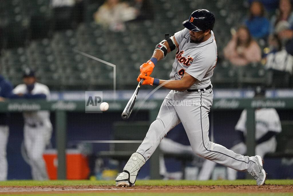 Ted S. Warren Detroit Tigers' Jeimer Candelario grounds out to first, allowing Robbie Grossman to score from third during the third inning of a baseball game against the Seattle Mariners, Tuesday, May 18, 2021, in Seattle. (AP Photo/Ted S. Warren)