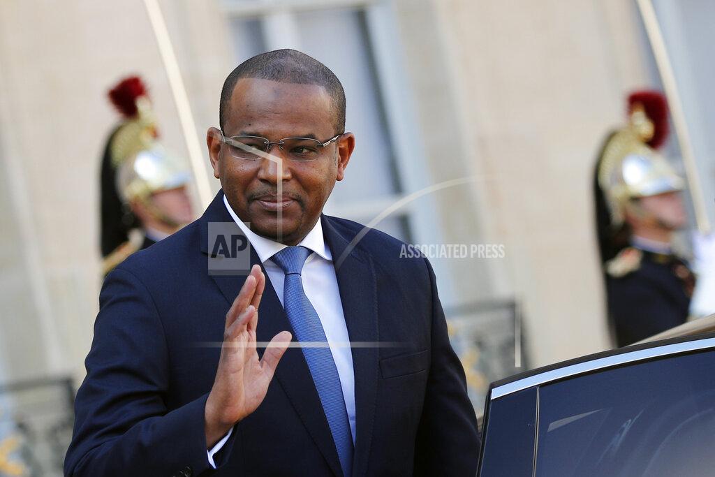 Francois Mori FILE - In this Tuesday, Sept. 10, 2019 file photo, Mali's prime minister Boubou Cisse waves to the press after his meeting with French president Emmanuel Macron at the Elysee Palace, in Paris, France. Cisse, who was believed to be sheltering with Mali's President Ibrahim Boubacar Keita, has urged soldiers to put down their arms and put the interests of the nation first after mutinous soldiers surrounded the private residence of Keita on Tuesday, Aug. 18, 2020 firing shots into the air and deepening fears of a coup attempt following several months of demonstrations calling for his resignation. (AP Photo/Francois Mori, File)