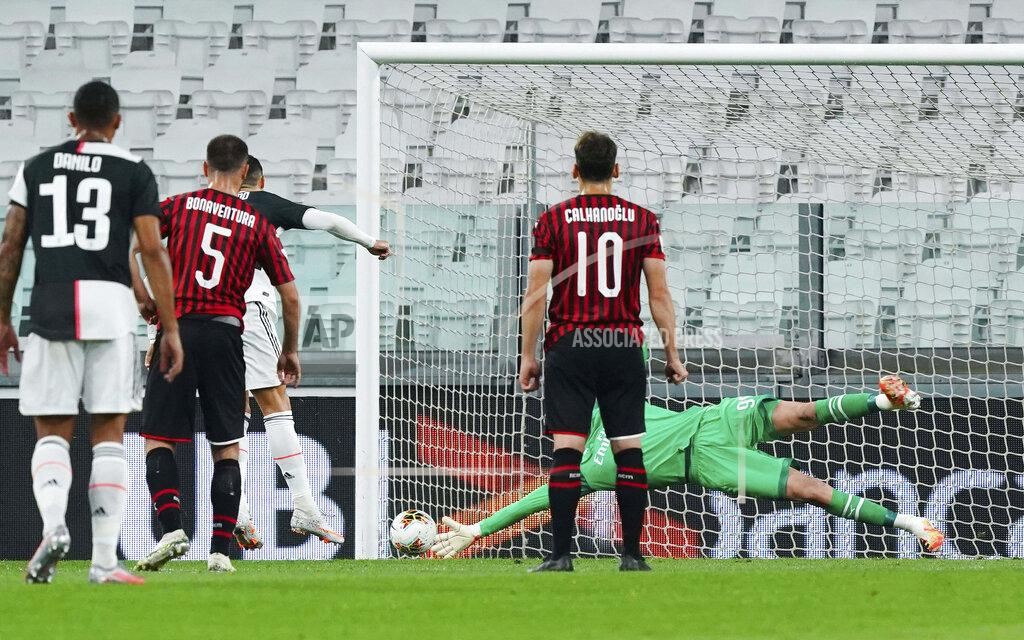 Spada Juventus' Cristiano Ronaldo hits the post on a penalty kick as AC Milan goalie Gianluigi Donnarumma dives, during an Italian Cup second leg soccer match between Juventus and AC Milan at the Allianz stadium, in Turin, Italy, Friday, June 12, 2020. The match was being played without spectators because of the coronavirus lockdown. (Spada/LaPresse via AP)