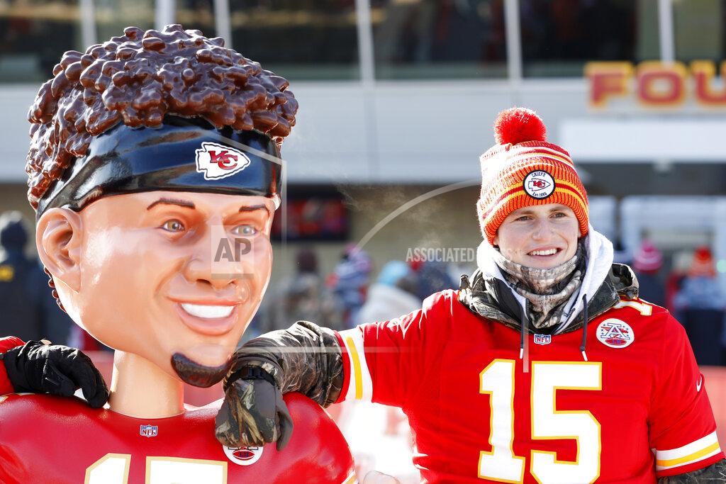 Charlie Neibergall A Kansas City Chiefs fan has a picture taken with a bobble head of Kansas City Chiefs quarterback Patrick Mahomes outside Arrowhead Stadium before the NFL AFC Championship football game against the Tennessee Titans Sunday, Jan. 19, 2020, in Kansas City, MO. (AP Photo/Charlie Neibergall)