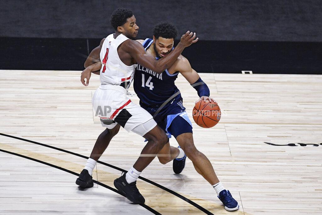 Jessica Hill Hartford's Moses Flowers fouls Villanova's Caleb Daniels during the second half of an NCAA college basketball game, Tuesday, Dec. 1, 2020, in Uncasville, Conn. (AP Photo/Jessica Hill)