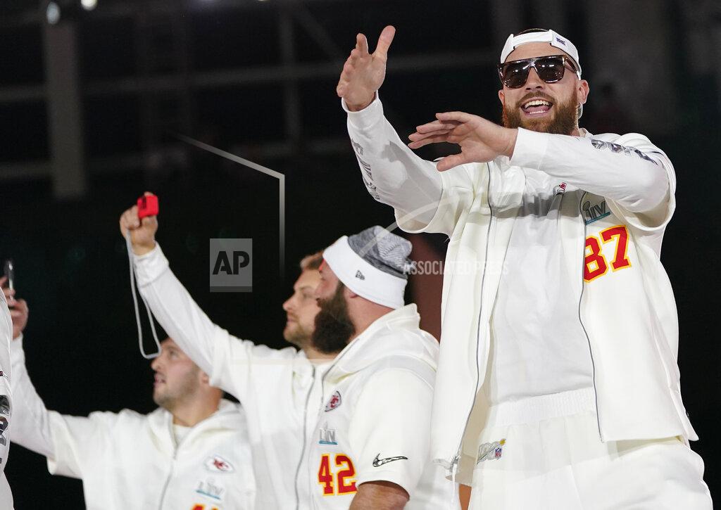 David J. Phillip Kansas City Chiefs Travis Kelce (87) arrives with his teammates for Opening Night for the NFL Super Bowl 54 football game Monday, Jan. 27, 2020, at Marlins Park in Miami. (AP Photo/David J. Phillip)