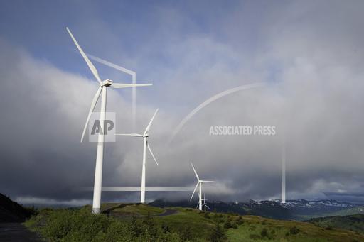 FILE - Wind turbines work on Sunday, June 25, 2023, in Kodiak, Alaska. To meet the goal of limiting global warming to 1.5 degrees Celsius (2.7 degrees Fahrenheit), nine major Asian economies must increase the share of electricity they get from renewable energy from the current 6% to at least 50% by 2030, according to a report by a German thinktank released Wednesday, Nov. 15, 2023. (AP Photo/Joshua A. Bickel, File)
