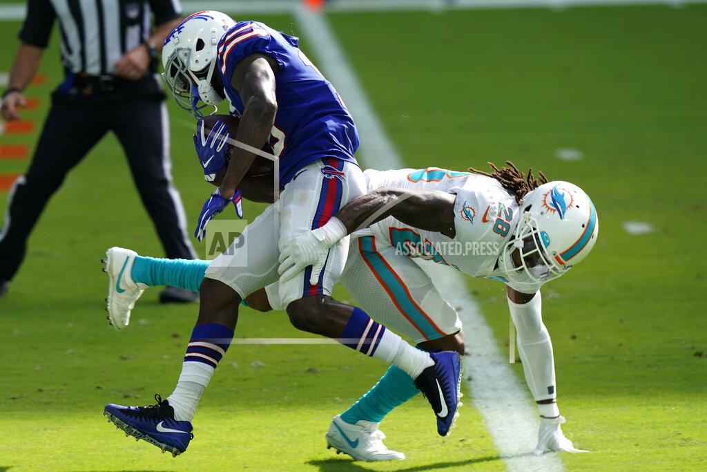 Lynne Sladky Buffalo Bills wide receiver John Brown (15) scores a touchdown as Miami Dolphins strong safety Bobby McCain (28) attempts to tackle, during the second half of an NFL football game, Sunday, Sept. 20, 2020, in Miami Gardens, Fla. The Bills defeated the Dolphins 31-28. (AP Photo/Lynne Sladky)
